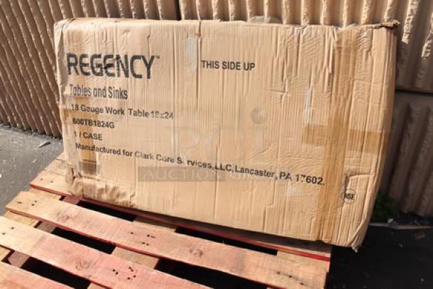 Brand new Regency stainless steel table and liquor display rack in original packaging. Box shows minor wear.