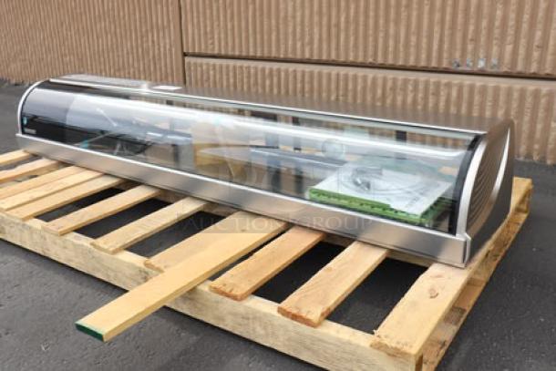 Brand new Hoshizaki HNC-180BA-L-SLH 71" curved glass sushi display case, left side compressor, on a pallet.