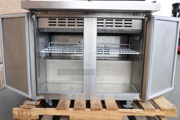Avantco SS-PT-36M-HC 36" 2-door stainless steel sandwich prep table, new condition, minor scratches/dents visible.