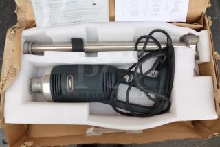 Open box Vonci Immersion Blender, model shown in packaging. Includes motor base, detachable blending shaft, and power cord.