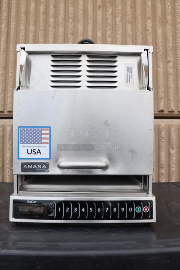 Brand new Amana AOC24 commercial microwave, 2400W, 208/240V, shows USA marking, serial number 2506180055, slight scratches.