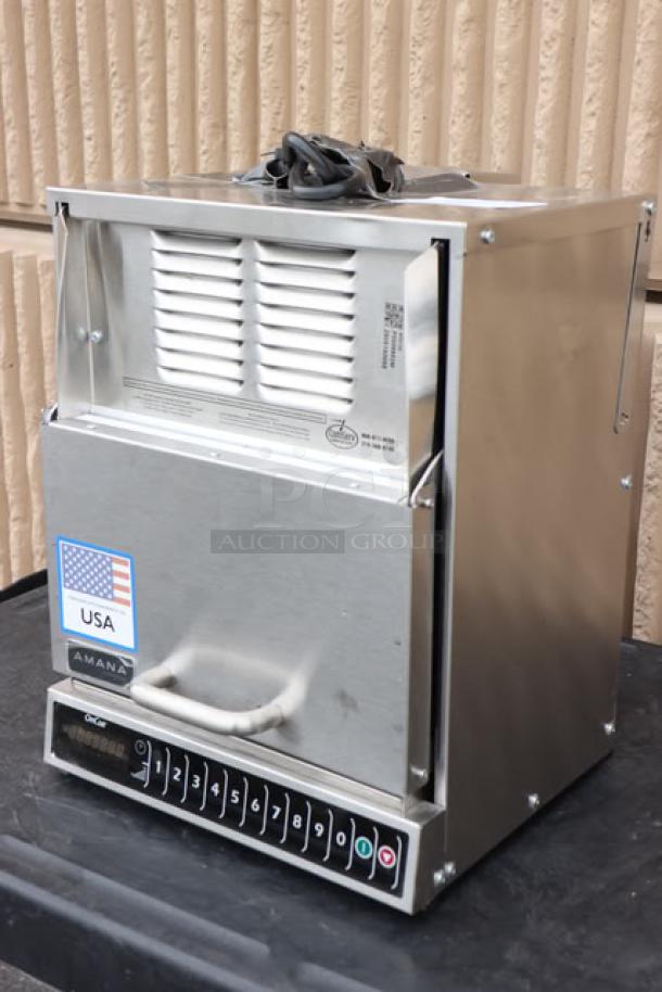 Brand new Amana AOC24 commercial microwave, 2400W, 208/240V, scratch-n-dent condition, serial 2506180055, USA-made.