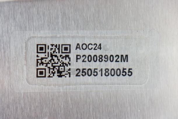 QR code and serial number label on Amana AOC24 commercial microwave showing model and serial number 2506180055.