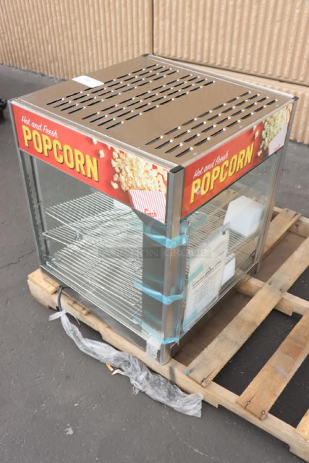 ServIt PDW18D2S 18" countertop display warmer, 4 shelves, glass damaged on one side, labeled for popcorn, on pallet.