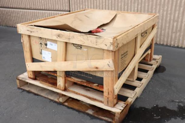 Brand new Avantco CAG-36-RC gas charbroiler, 90,000 BTU, in damaged box; light rust on griddle edge visible.