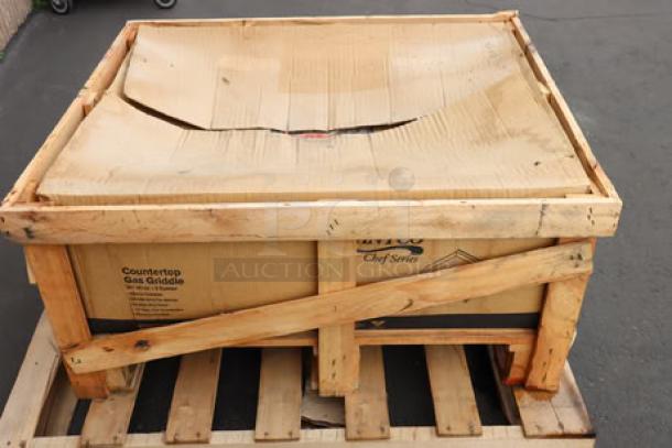 Brand new Avantco CAG-36-RC 36" gas charbroiler in box; 90,000 BTU. Damaged packaging, light rust on griddle edge.