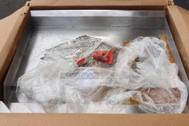 Brand new Avantco Chef Series CAG-36-RC 36" Gas Charbroiler in box, 90,000 BTU. Packaging damaged, light rust on griddle edge.