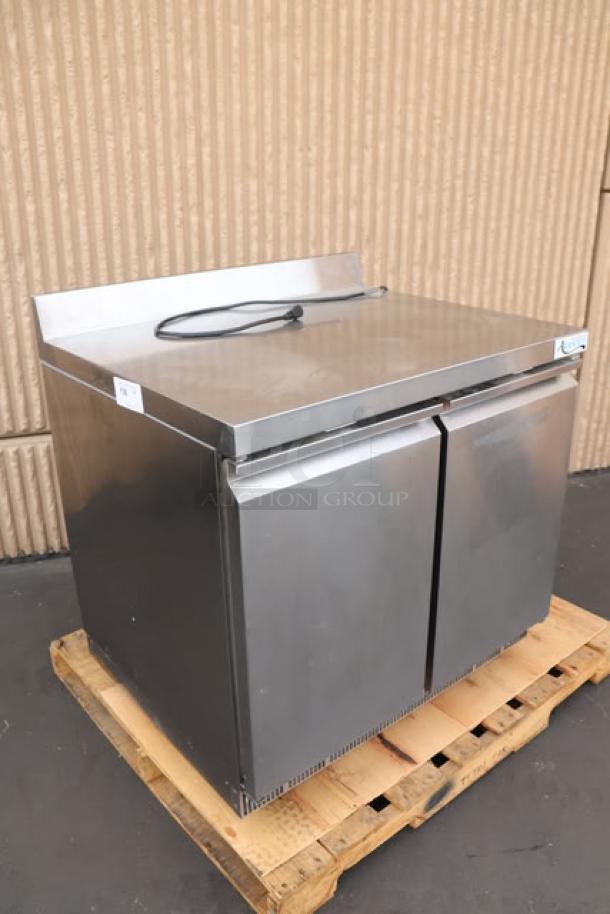 Brand new Avantco ZWT-36R-HC 36" worktop refrigerator, minor dents, 3.5" backsplash, S/N: 859653855, working condition.