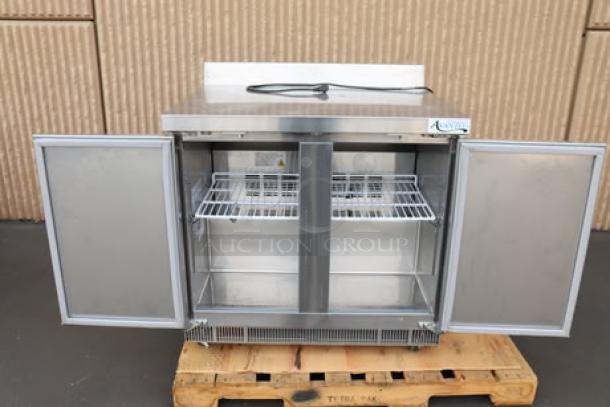 Brand new Avantco ZWT-36R-HC 36" worktop refrigerator, front breathing, minor scratch, with 3 1/2" backsplash, open doors.