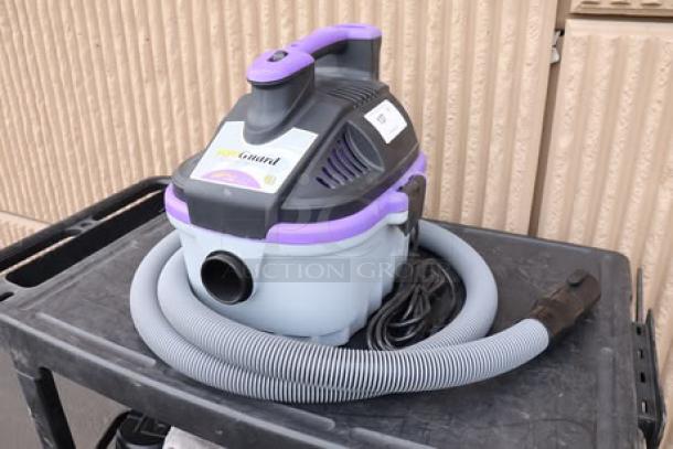 BRAND NEW ProTeam 107128 4 Gallon ProGuard Wet/Dry Vacuum, 120V, on cart, hose attached. Missing original packaging, brand label visible.