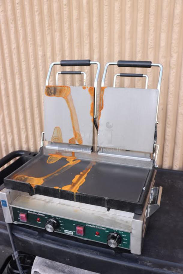 Brand new Waring WFG300 Tostato Ottimo dual panini grill, 17"x9.25" surface, smooth top and bottom, 240V, 3120W, with minor scratches.