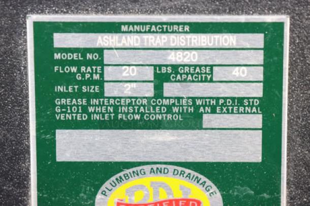 Brand new Ashland PolyTrap 4820 grease trap label showing 20 GPM flow rate, 40 lb. capacity, and 2" inlet size.