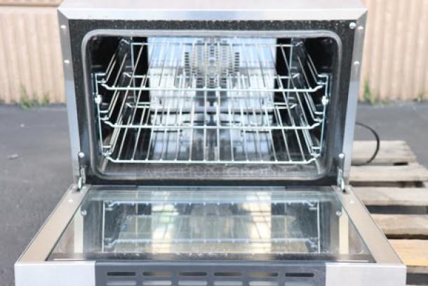 Moffat E23M3-T Turbofan convection oven, new, open door, metal racks, silver finish, 220-240V, mechanical controls.