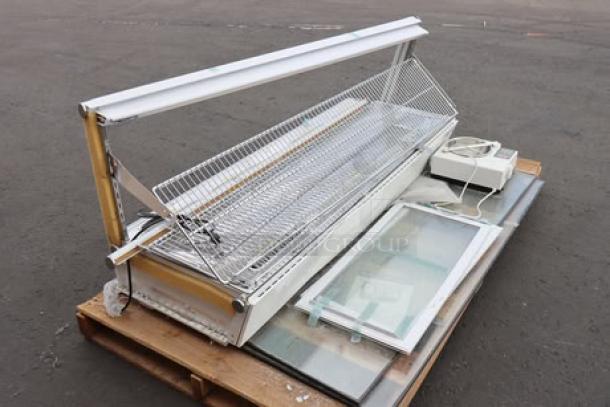 ChocoVision C116USREV2WHI Revolation 2 Chocolate Tempering Machine and heated display, parts only, on pallet.