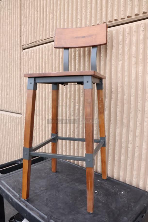 Lancaster Table & Seating industrial bar stool, rustic walnut finish, model 164BINDWALAN, new condition, no original packaging.