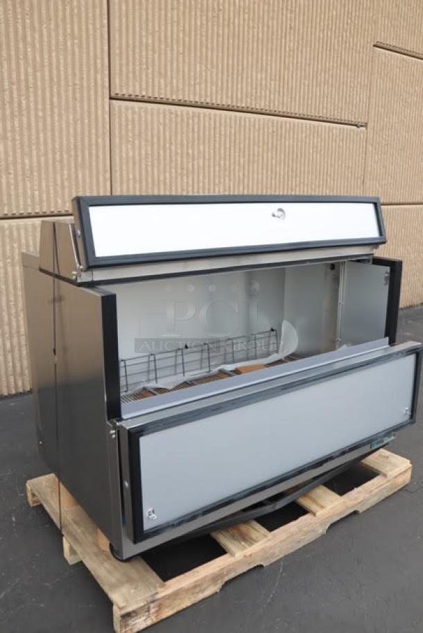 Brand new True TMC-58-S-HC 58" one-sided milk cooler, stainless steel exterior, aluminum interior, 115V, 2.7A, S/N: 11217224.