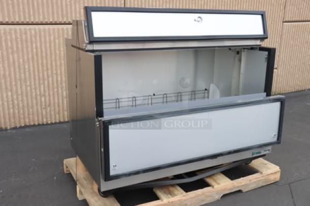 Brand new True TMC-58-S-HC milk cooler, stainless steel exterior, aluminum interior, 58 1/4", 115V, 2.7A, 1 phase. S/N: 11217224.