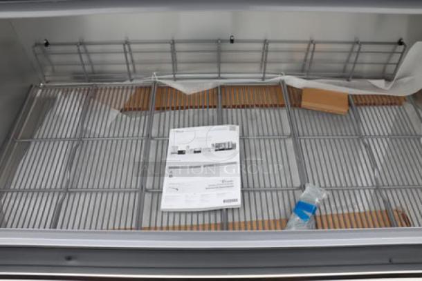 Brand new True TMC-58-S-HC milk cooler, stainless steel exterior, aluminum interior, 115V, 2.7A, one-sided access.