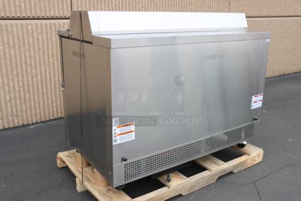 Brand new True TMC-58-S-HC milk cooler with a stainless steel exterior, aluminum interior, and visible safety labels.