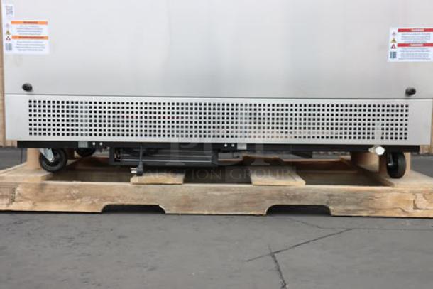 Brand new True TMC-58-S-HC milk cooler with stainless steel exterior, aluminum interior. Model info on visible labels.