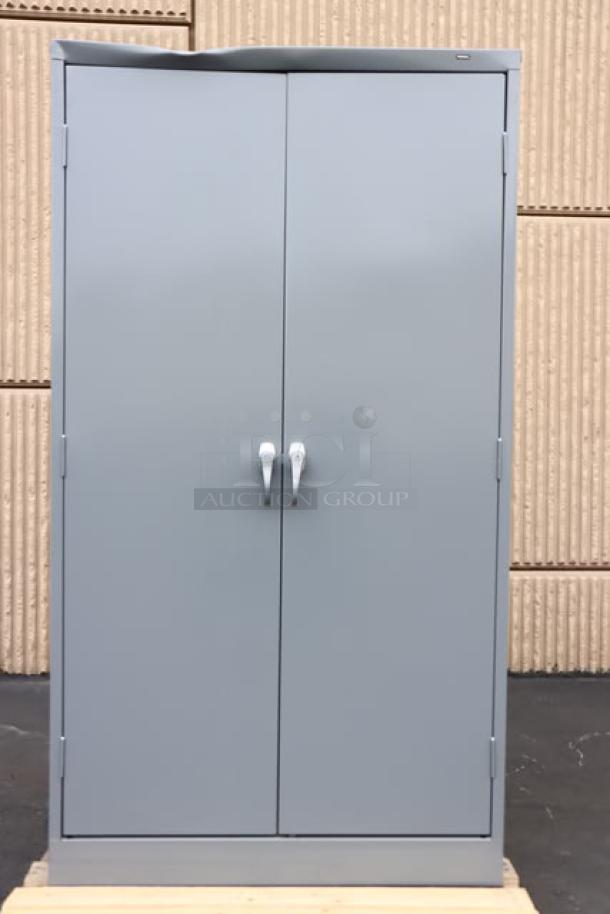 Brand new Tennsco 6618DH-MGY storage cabinet, 18"x36"x66". Dark gray with solid doors. Scratch-n-dent condition.