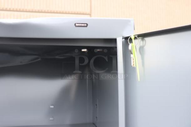 Tennsco 18"x36"x66" dark gray storage cabinet with solid doors; model 6618DH-MGY; brand label visible; new condition.