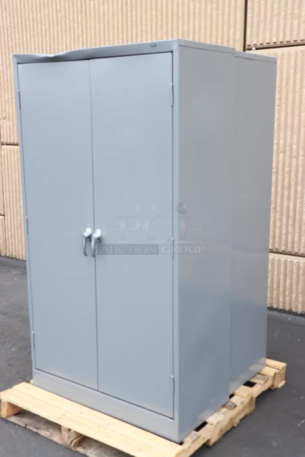 Tennsco 18"x36"x66" dark gray storage cabinet, model 6618DH-MGY, with solid doors, slight top dent, new condition, assembled.