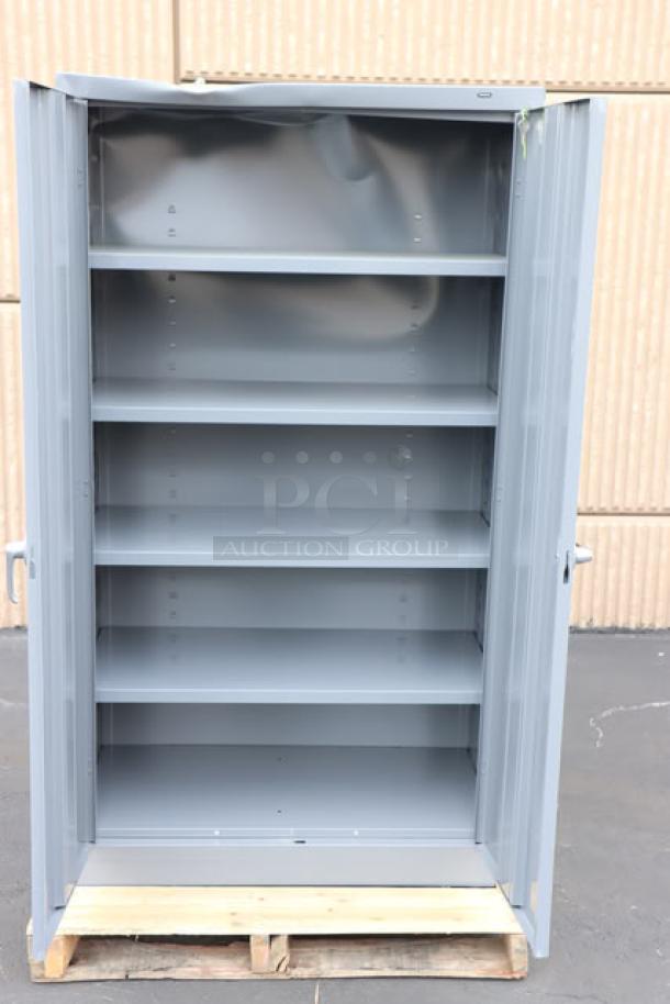 Brand new Tennsco 6618DH-MGY storage cabinet, 18" x 36" x 66", dark gray, solid doors, visible dent, 5 shelves, assembled.