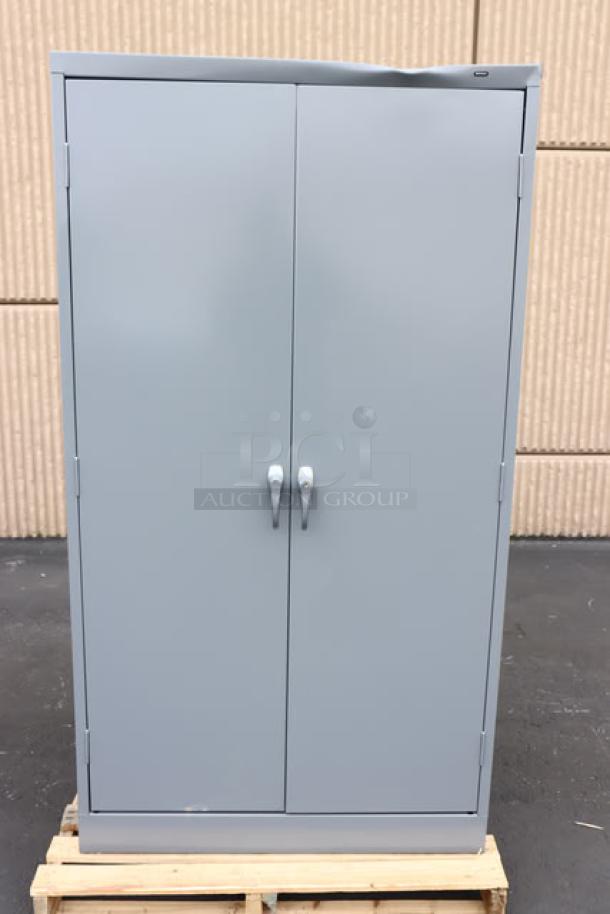 Brand new Tennsco 6618DH-MGY 18"x36"x66" dark gray storage cabinet with solid doors, scratch-n-dent, assembled.