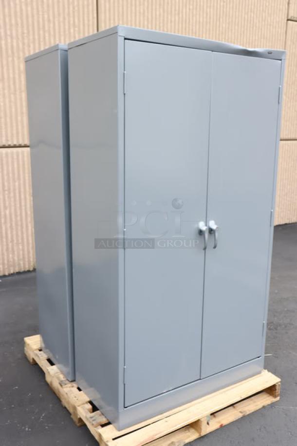 Brand new Tennsco 6618DH-MGY storage cabinet, dark gray, 18"x36"x66", solid doors, minor cosmetic flaws, assembled.