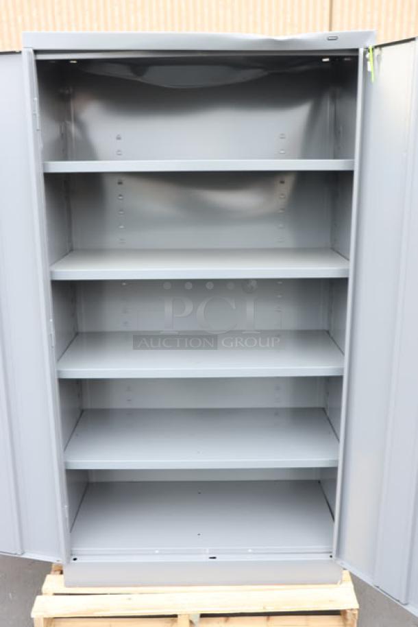 Brand new Tennsco 6618DH-MGY dark gray storage cabinet, 18"x36"x66", solid doors, light scratches, assembled.