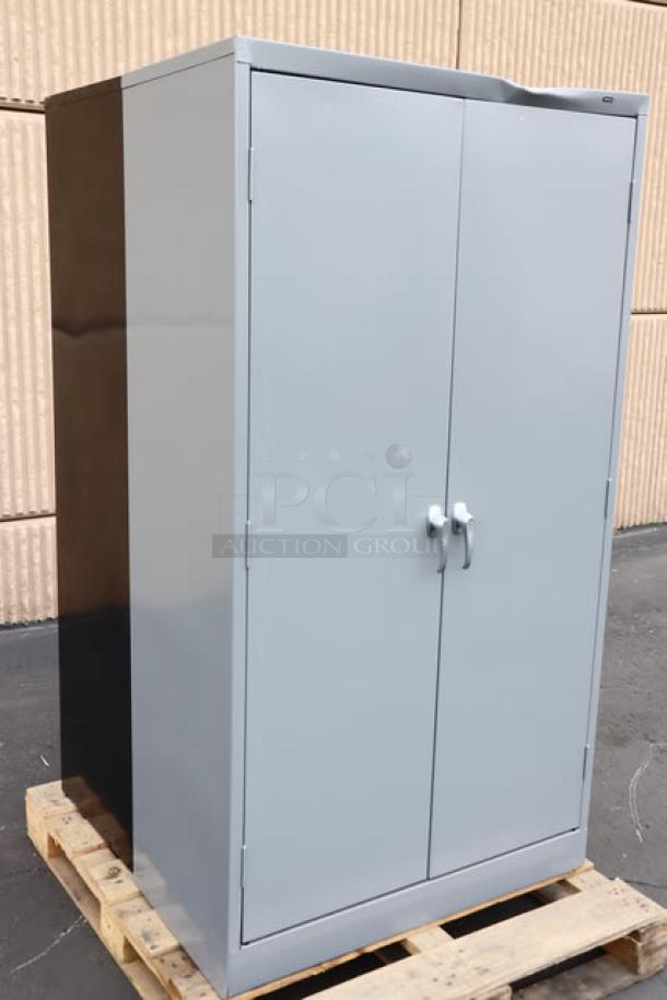 Tennsco 18"x36"x66" dark gray storage cabinet with solid doors, model 6618DH-MGY, new scratch-n-dent condition.
