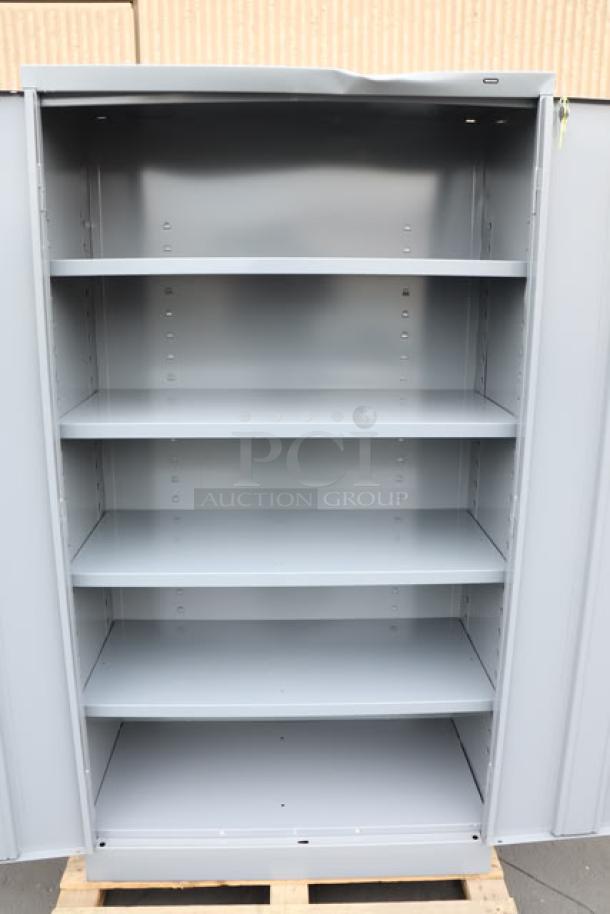 Tennsco 6618DH-MGY storage cabinet, 18"x36"x66", dark gray, solid doors, 5 shelves, brand new, minor dents visible.