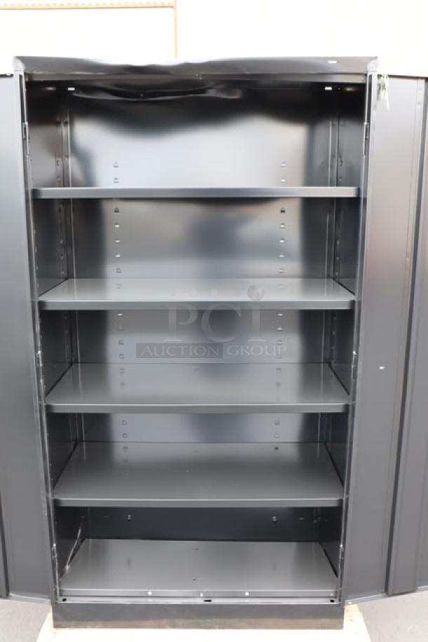 Tennsco dark gray storage cabinet, model 6618DH-MGY, measures 18"x36"x66", five shelves, solid doors, minor scratches.