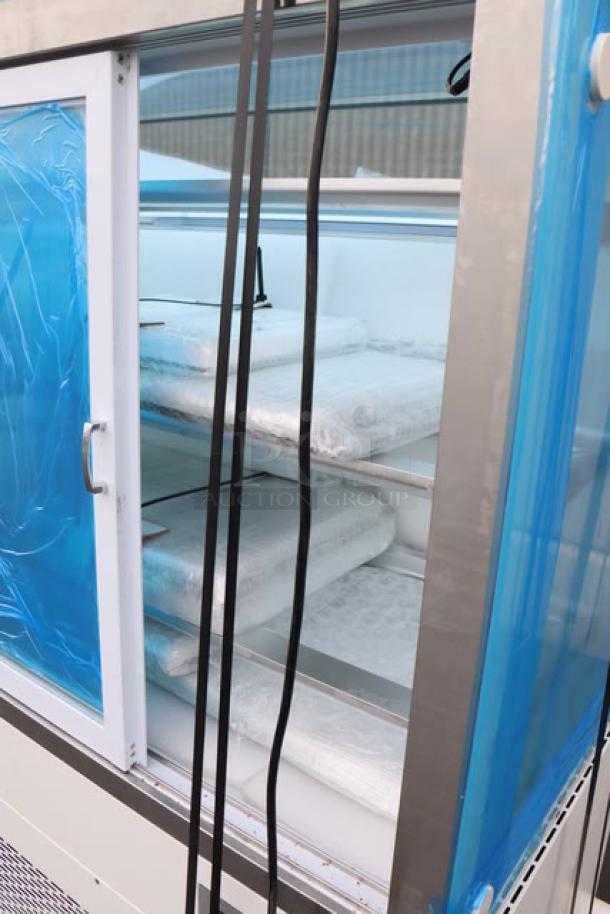 Brand new Avantco BCF-72-HC 70 7/8" square glass refrigerated bakery display case, unboxed, with visible shelving.