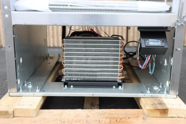 Beverage-Air HBR27HC-1 refrigerator, bottom mounted, showing coils and wiring. New, may have scratches and dents. LED lighting.