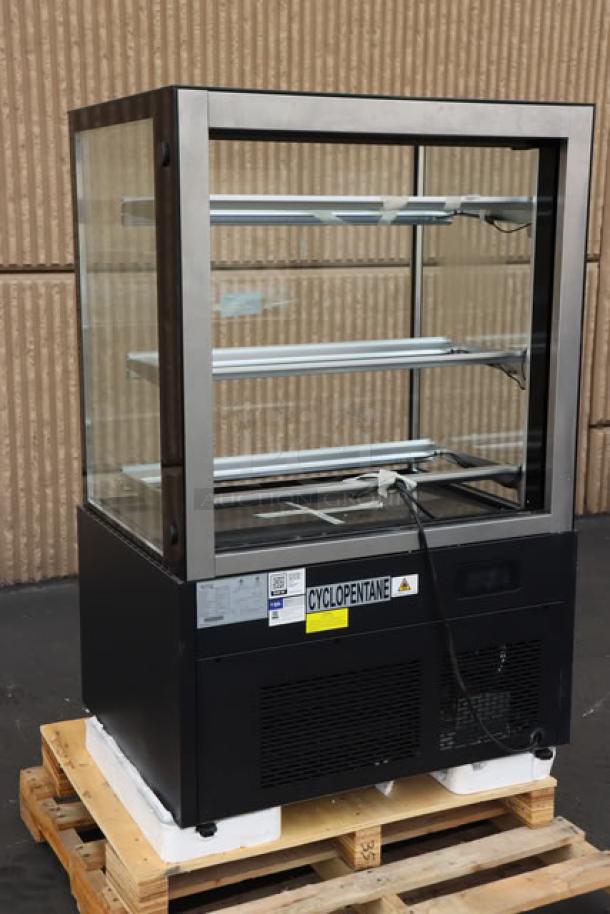 Brand new Avantco BCF-36-HC bakery display case; 35 3/8", black, missing glass doors and shelves, model label visible.