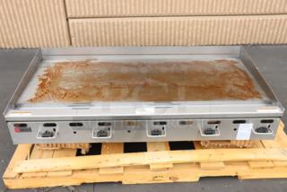 BRAND NEW Wolf by Vulcan AGM60-LP griddle, 60" gas, 135,000 BTU, missing legs, syrup spilled, manual controls visible.