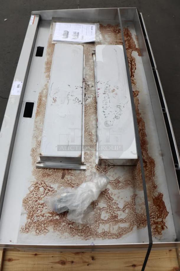 BRAND NEW Wolf by Vulcan AGM60-LP griddle, missing legs, syrup spill on surface, 60" wide, 135,000 BTU, manual controls.