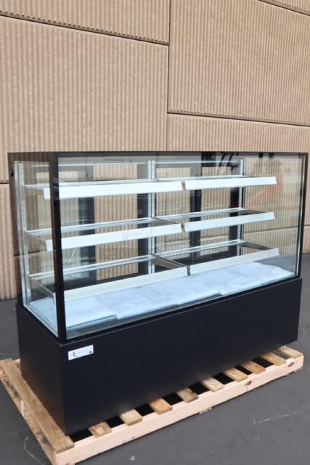 Brand new Avantco BCF-72-HC refrigerated bakery display case, 70 7/8", black, with square glass, on wooden pallet.