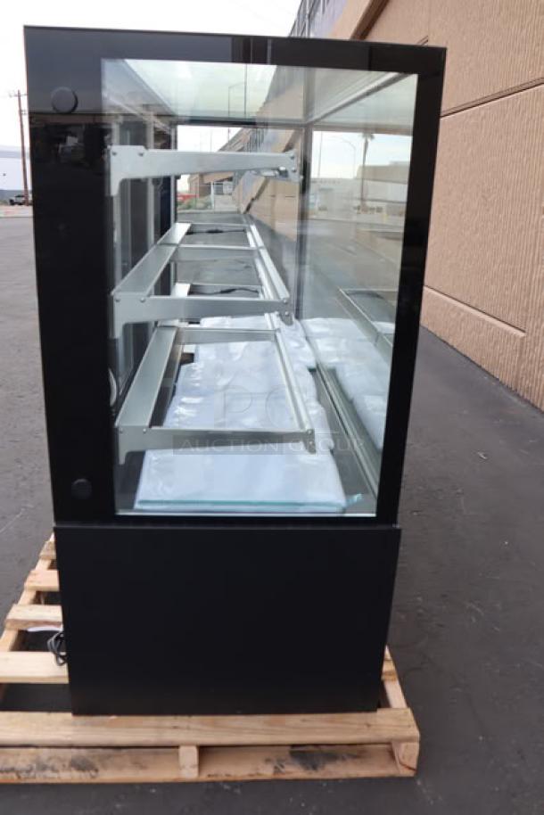 Brand new Avantco BCF-72-HC black refrigerated bakery display case, 70 7/8" glass, 115V, 8.5A, 1 phase, on pallet.