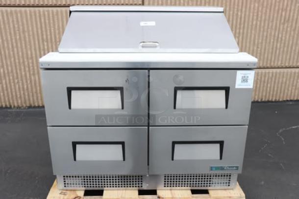True TFP-48-18M-D-4-HC Mega Top refrigerated prep table, brand new, with four drawers and 18 food pans. Minor scratches. S/N: 11131476.