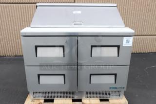True TFP-48-18M-D-4-HC Mega Top refrigerated prep table, brand new, with four drawers and 18 food pans. Minor scratches. S/N: 11131476.