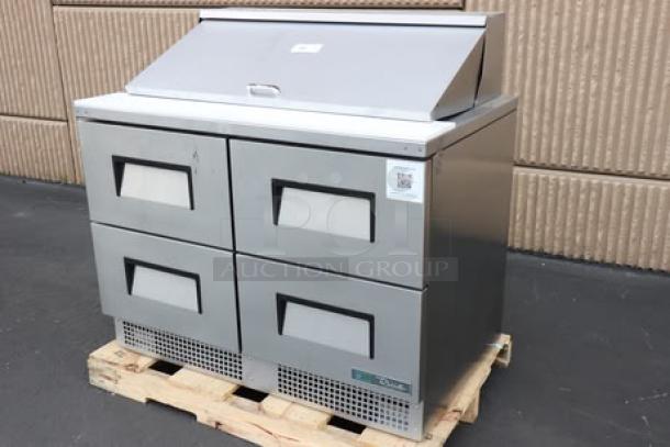 Brand new True TFP-48-18M-D-4-HC refrigerated sandwich prep table with four drawers, minor scratches; out of packaging.