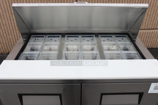 True TFP-48-18M-D-4-HC Mega Top Sandwich Prep Table with 18 pans, 4 drawers, cutting board. New with minor scratches.