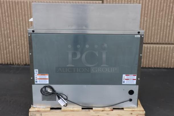 True TFP-48-18M-D-4-HC Mega Top Refrigerated Sandwich Prep Table with four drawers on pallet, minor scratches.