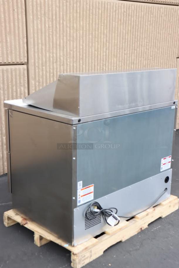 True TFP-48-18M-D-4-HC refrigerated sandwich prep table, new, minor surface scratches, 48 1/8", four drawers, 115V.