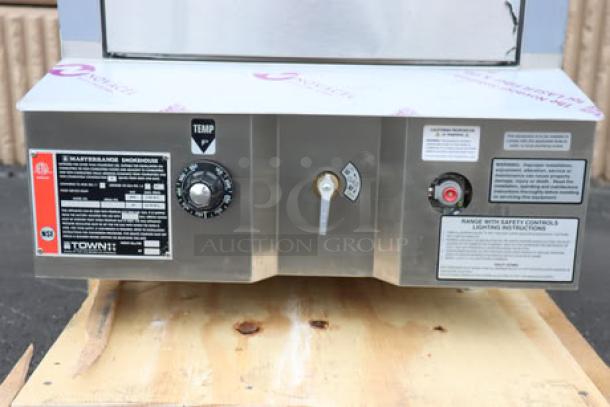Brand new Town SM-24-L-SS stainless steel smokehouse, natural gas, 24", 45,000 BTU, left door hinges, serial #2643178.