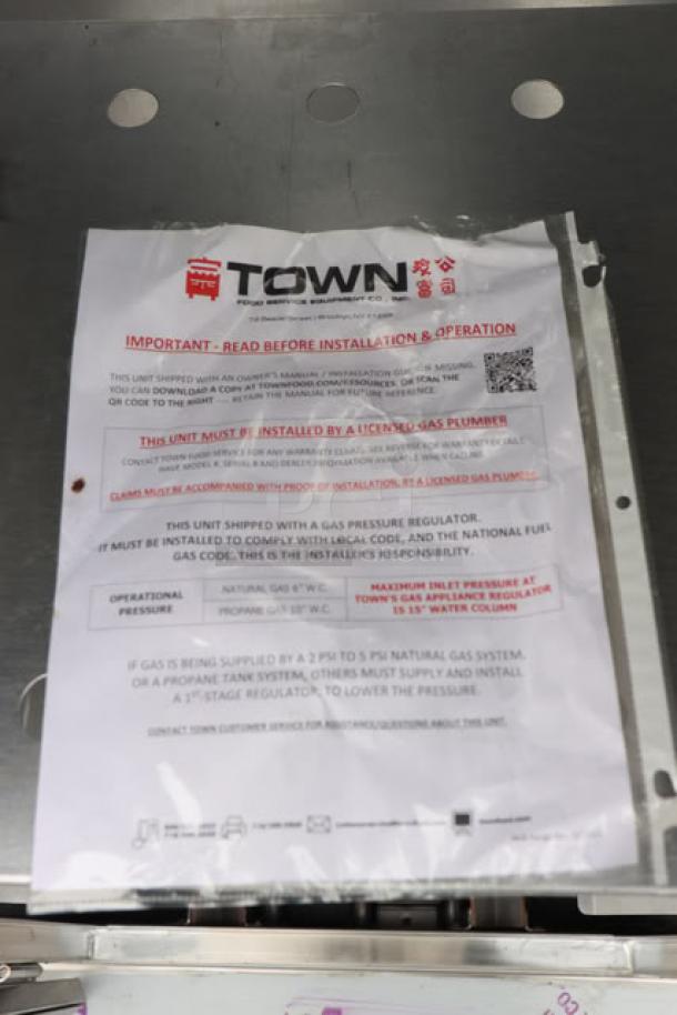 Brand new Town SM-24-L-SS smokehouse info sheet and stainless steel surface, 45,000 BTU, left door hinges, S/N: 2643178.