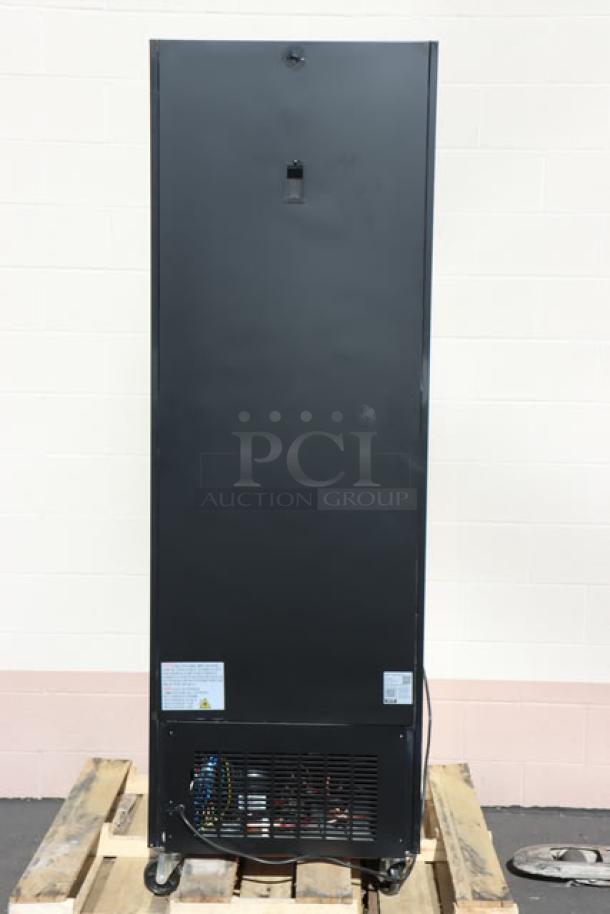 Avantco GDC-12F-HC 27" black merchandiser freezer, swing glass door, LED lighting, new condition, tags visible.